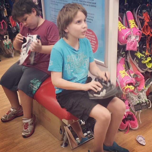 boys trying on shoes